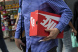 A shopper carries a Nike Inc. shoebox.